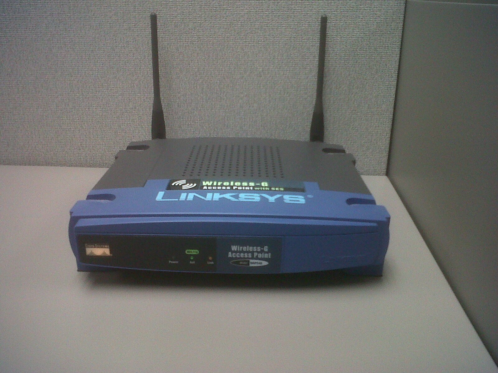 A real wireless access point with an external antenna and Ethernet cable